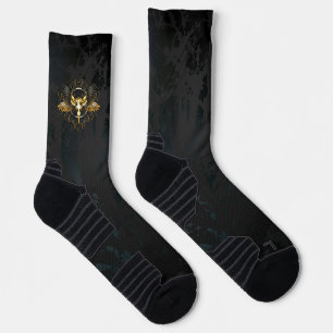 Golden Bird Skull auf schwarzem Hintergrund Socken