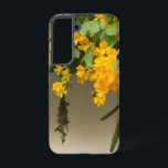 Golden Blossom Beauty Samsung Galaxy Hülle<br><div class="desc">Bright golden flowers hanging among fresh green leaves create a beautiful and peaceful scene of nature. The vibrant yellow blooms look like a natural waterfall of flowers, spreading warmth and charm. This lovely view shows the simple yet stunning beauty of nature, where every petal and leaf comes together like a...</div>