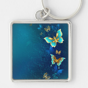 Golden Butterflies on a Blue Background Schlüsselanhänger