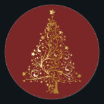 Golden Christmas Tree on Red Runder Aufkleber<br><div class="desc">Weihnachtsbaum in goldgelben Schattierungen zur Simulation von metallischem Gold. Der Weihnachtsbaum besteht aus Kehren mit Sternschmuck und mit einem goldenen Stern überragt. Set auf dunkelweihnachtrot.</div>