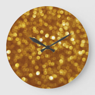 Golden defokussierter Glitzer, funkelnde Textur. Große Wanduhr