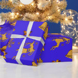 Golden Reindeer Blue Christmas Geschenkpapier<br><div class="desc">A festive Christmas wrapping paper featuring a pattern of golden reindeer,  Christmas bells,  gold holly with red ruby berries,  and gold snowflakes on a colorful blue background.</div>