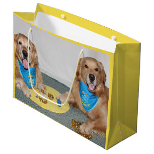 Golden retriever, das Dreidel Chanukka spielt Große Geschenktüte