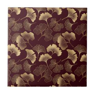Goldene Ginkgoblätter auf roter eleganter Botanik Fliese