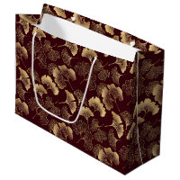Goldene Ginkgoblätter auf roter eleganter Botanik