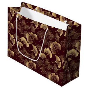 Goldene Ginkgoblätter auf roter eleganter Botanik Große Geschenktüte