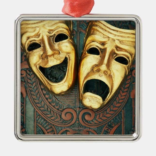 Goldene Komödien- und Tragödiemasken auf Ornament Aus Metall (Vorne)