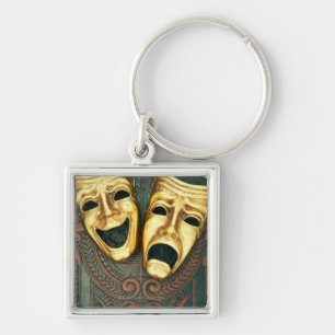Goldene Komödien- und Tragödiemasken auf Schlüsselanhänger