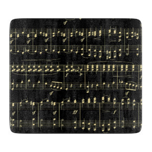 Goldene Musik auf Schwarz Schneidebrett