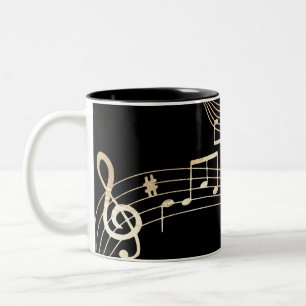 Goldene Noten auf schwarzem Hintergrund Zweifarbige Tasse