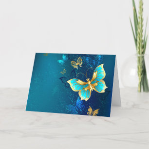 Goldene Schmetterlinge auf blauem Hintergrund Feiertagskarte