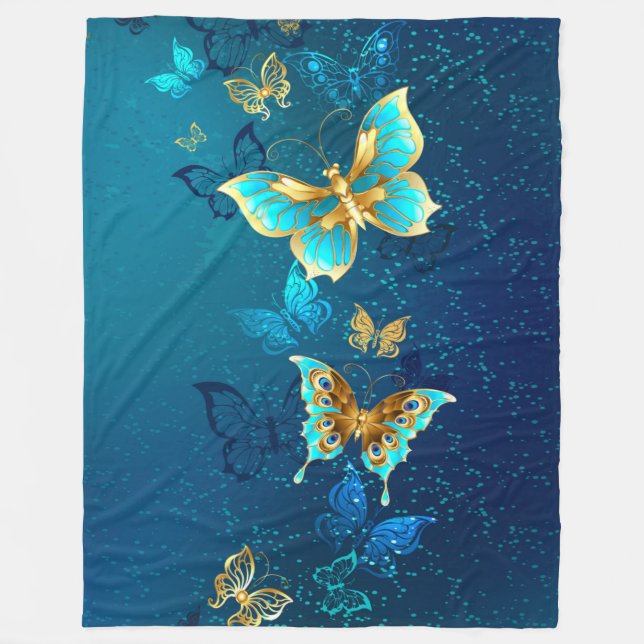 Goldene Schmetterlinge auf blauem Hintergrund Fleecedecke (Vorderseite)