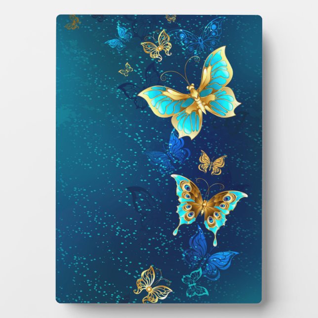 Goldene Schmetterlinge auf blauem Hintergrund Fotoplatte (Vorderseite)