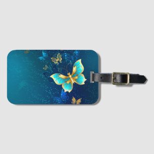 Goldene Schmetterlinge auf blauem Hintergrund Gepäckanhänger