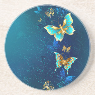 Goldene Schmetterlinge auf blauem Hintergrund Getränkeuntersetzer