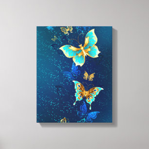 Goldene Schmetterlinge auf blauem Hintergrund Leinwanddruck
