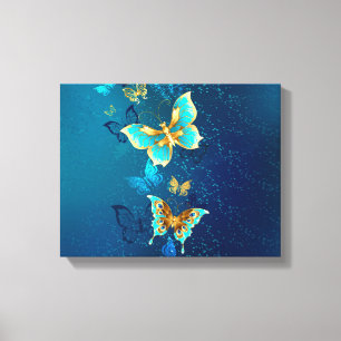 Goldene Schmetterlinge auf blauem Hintergrund Leinwanddruck
