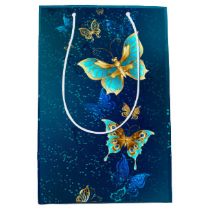 Goldene Schmetterlinge auf blauem Hintergrund Mittlere Geschenktüte