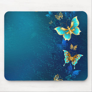 Goldene Schmetterlinge auf blauem Hintergrund Mousepad