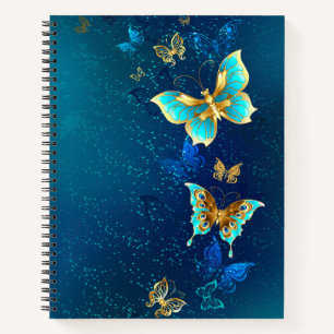 Goldene Schmetterlinge auf blauem Hintergrund Notizbuch