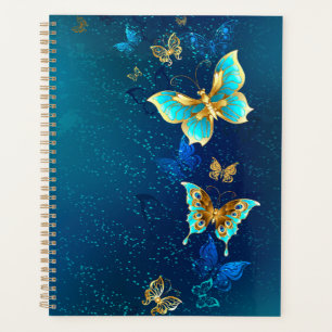 Goldene Schmetterlinge auf blauem Hintergrund Planer