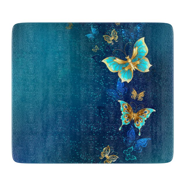 Goldene Schmetterlinge auf blauem Hintergrund Schneidebrett (Vorderseite)