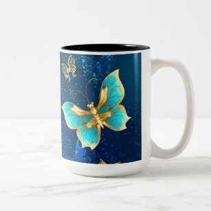 Goldene Schmetterlinge auf blauem Hintergrund Zweifarbige Tasse