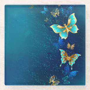 Goldene Schmetterlinge auf einem blauen Hintergrun Glasuntersetzer