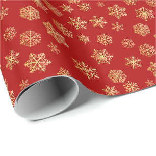 Goldene Schneeflocken auf rotem Hintergrund Geschenkpapier
