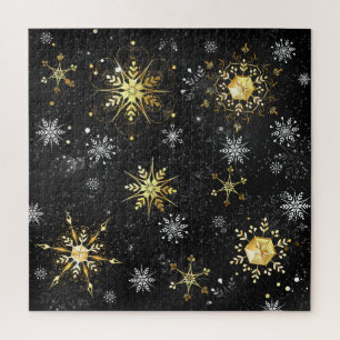 Goldene Schneeflocken auf schwarzem Hintergrund
