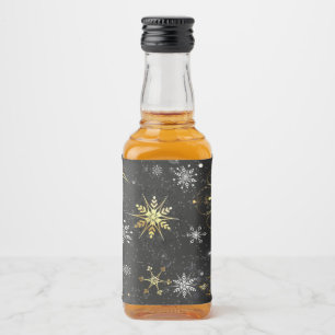 Goldene Schneeflocken auf schwarzem Hintergrund Alkoholflaschenetikett