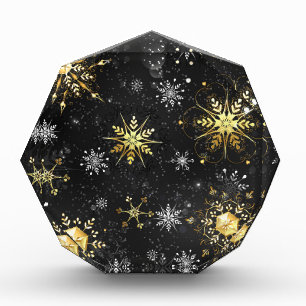 Goldene Schneeflocken auf schwarzem Hintergrund Fotoblock