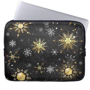 Goldene Schneeflocken auf schwarzem Hintergrund Laptopschutzhülle