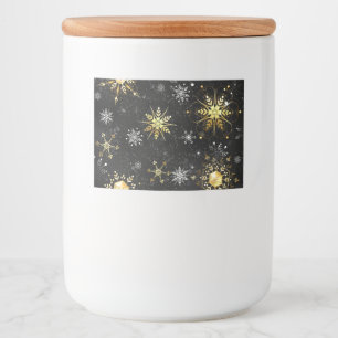 Goldene Schneeflocken auf schwarzem Hintergrund Lebensmitteletikett