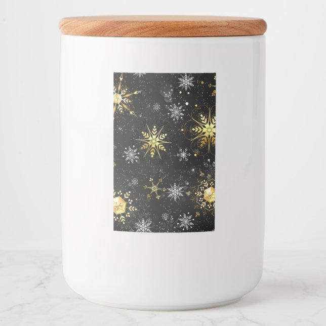 Goldene Schneeflocken auf schwarzem Hintergrund Lebensmitteletikett (Vorderseite)