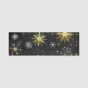 Goldene Schneeflocken auf schwarzem Hintergrund Namensschild
