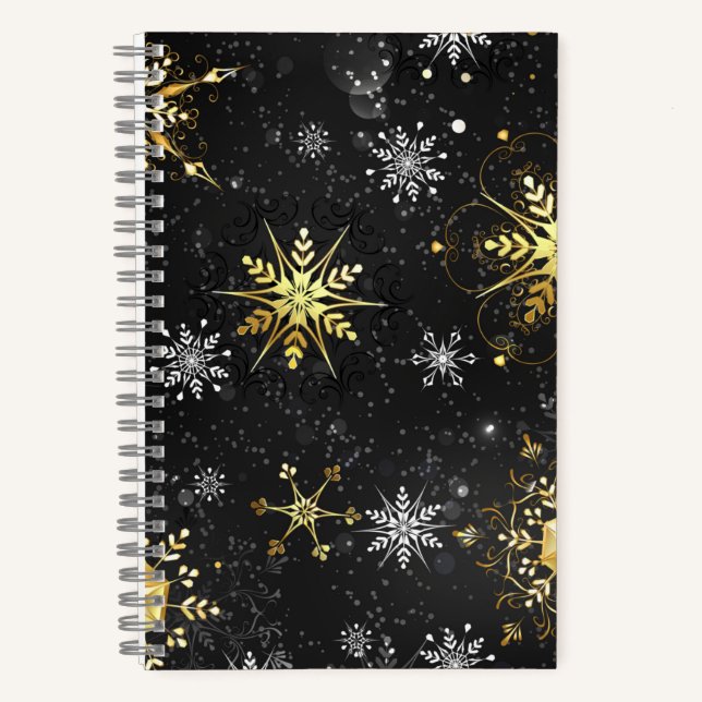 Goldene Schneeflocken auf schwarzem Hintergrund Notizbuch (Vorderseite)