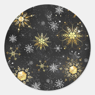 Goldene Schneeflocken auf schwarzem Hintergrund Runder Aufkleber