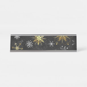 Goldene Schneeflocken auf schwarzem Hintergrund Schreibtischnamensplakette
