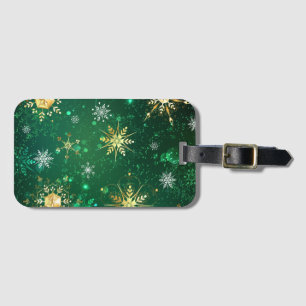 Goldene Schneeflocken im grünen Hintergrund Gepäckanhänger