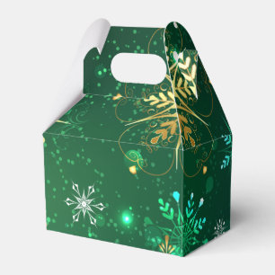 Goldene Schneeflocken im grünen Hintergrund Geschenkschachtel