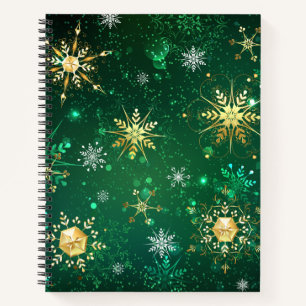 Goldene Schneeflocken im grünen Hintergrund Notizbuch