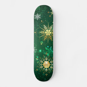 Goldene Schneeflocken im grünen Hintergrund Skateboard