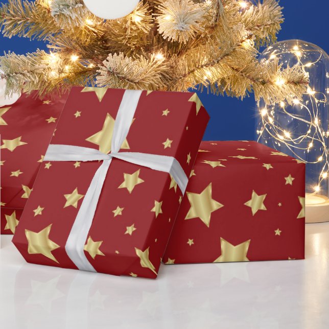 Goldene Sterne auf rotem Hintergrund Geschenkpapier (Feiertage)