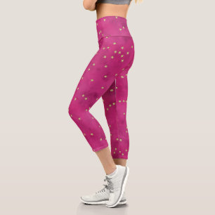 Goldene Sterne im rosa Hintergrund Capri Leggings