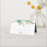 Goldene tropische Platzkarte Hochzeitsfeier<br><div class="desc">Diese Platzkarte mit goldblühenden tropischen Pflanzen ist perfekt für eine Hochzeit in Urlaubsort. Das Design zeichnet sich vor allem durch handbemaltes grünes Blattwerk in Aquarell und goldene Blume aus. Personalisieren Sie die Rückseite der Platzkarte mit den Namen der Braut und Bräutigam und dem Datum.</div>
