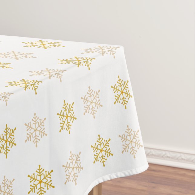 Goldene Weihnachtsschneeflocken auf Weiß Tischdecke (Beispiel)