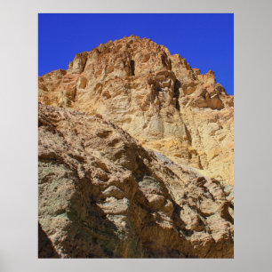 Goldene Wüstenklippe unter blauem Himmel Poster