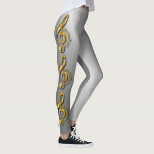 Goldener dreifacher Clef mit Anmerkungen und Leggings