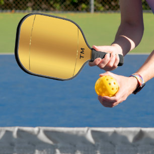 Goldener Hintergrund, glänzender goldener Streifen Pickleball Schläger